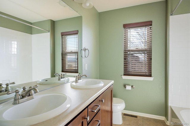 bathroom with tile patterned flooring, a sink, and visible vents