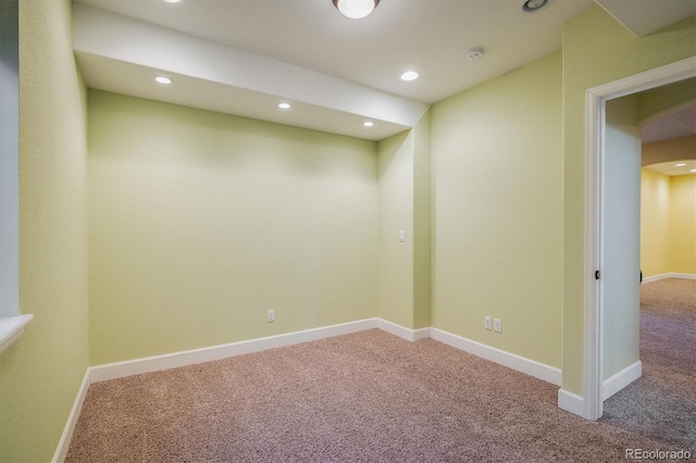 basement featuring baseboards, carpet flooring, and recessed lighting