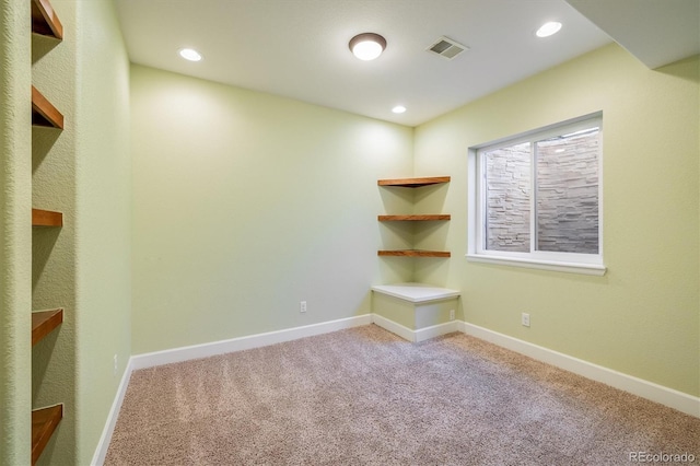 carpeted empty room with recessed lighting, visible vents, and baseboards