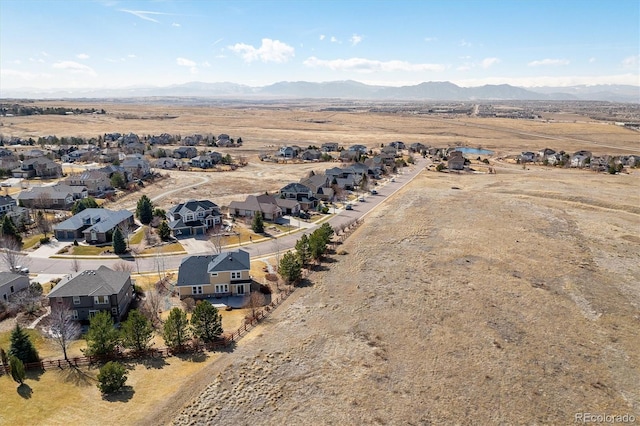 bird's eye view with a residential view and a mountain view