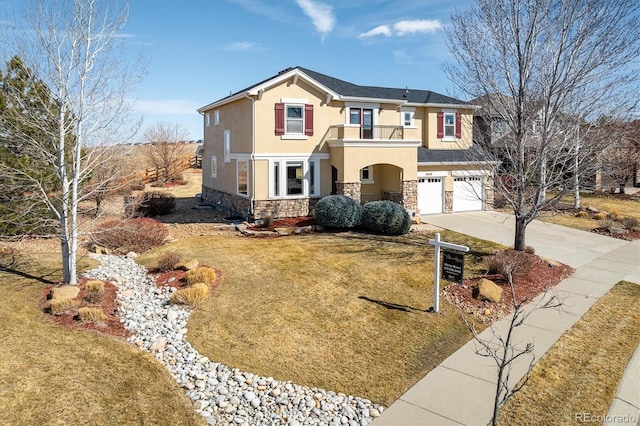 view of front facade featuring a garage, stone siding, driveway, stucco siding, and a front lawn