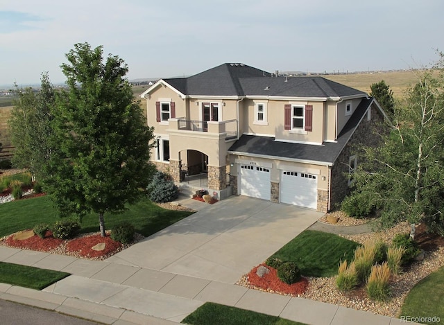 view of front of property featuring stucco siding, concrete driveway, an attached garage, a balcony, and stone siding