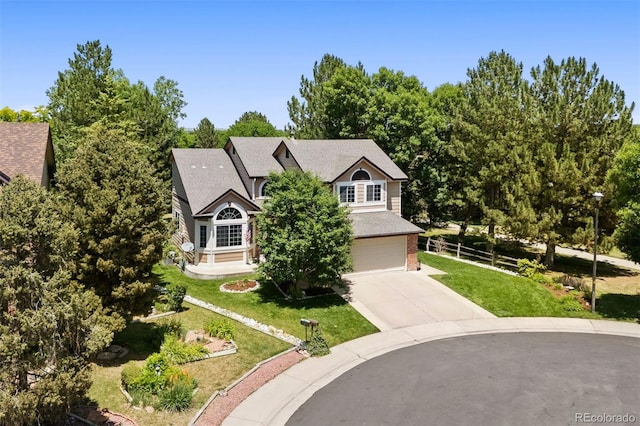 1473 E 130th Dr, Thornton, CO 80241 - view of front of home with concrete driveway, brick siding, an attached garage, and roof with shingles