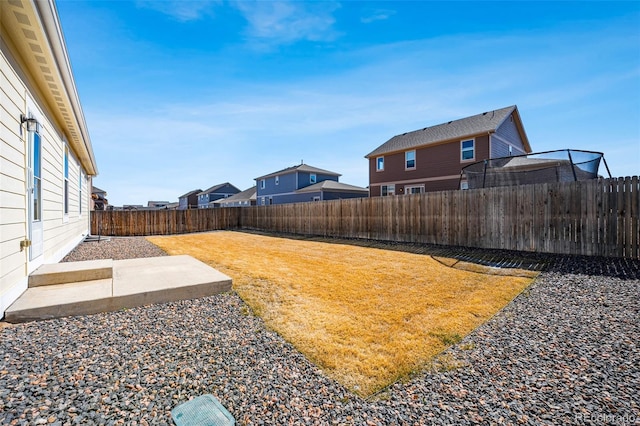 view of yard with a patio area and a fenced backyard