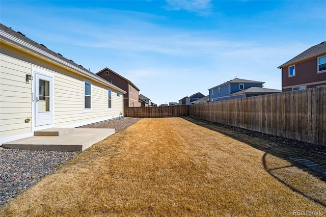 view of yard featuring a patio area and a fenced backyard