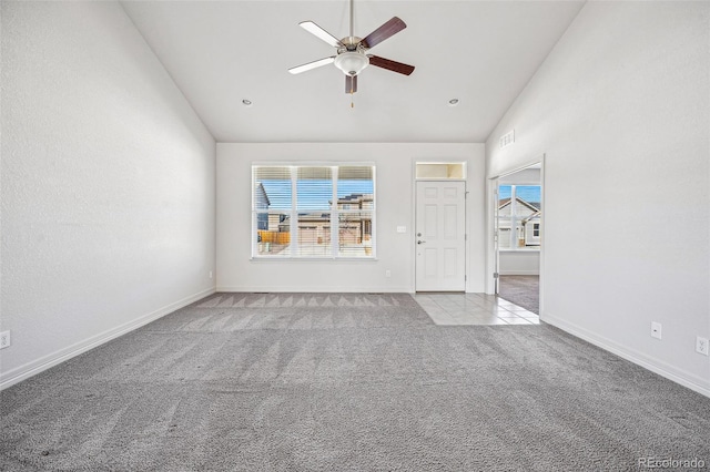 unfurnished living room featuring high vaulted ceiling, carpet flooring, a ceiling fan, and baseboards