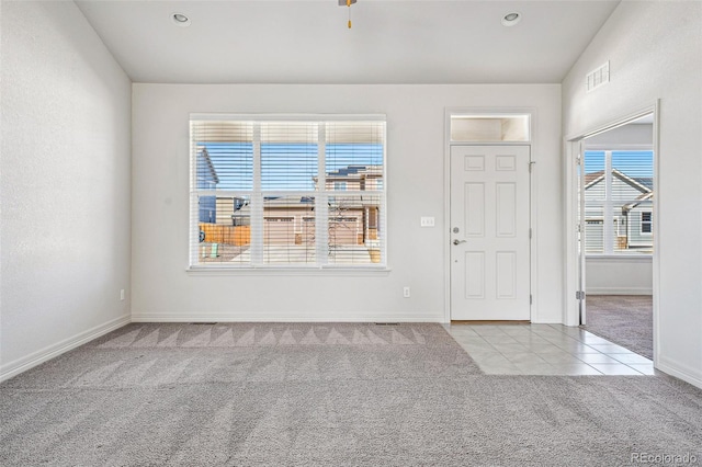 carpeted foyer entrance featuring baseboards, recessed lighting, visible vents, and tile patterned floors