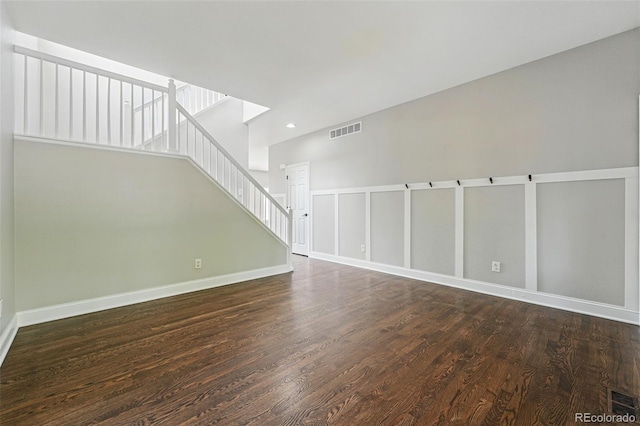 1248 Button Rock Dr, Longmont, CO 80504 - unfurnished living room featuring wood finished floors, stairway, baseboards, and recessed lighting