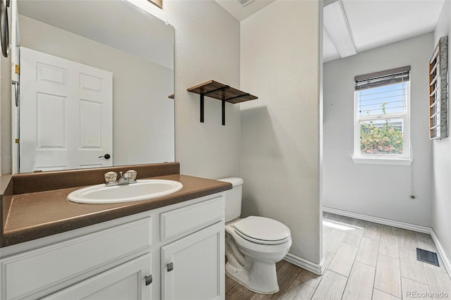 1248 Button Rock Dr, Longmont, CO 80504 - half bathroom with toilet, vanity, and baseboards