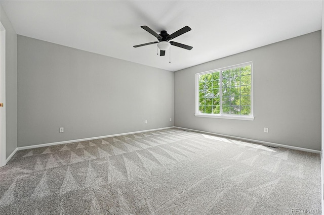 1248 Button Rock Dr, Longmont, CO 80504 - empty room featuring carpet, baseboards, and ceiling fan