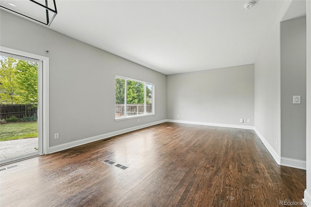 1248 Button Rock Dr, Longmont, CO 80504 - spare room with plenty of natural light, wood finished floors, a smoke detector, and baseboards