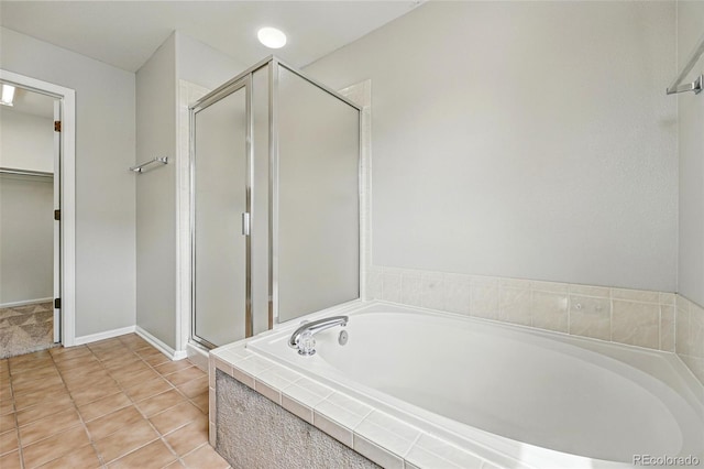 1248 Button Rock Dr, Longmont, CO 80504 - bathroom with a shower stall, a bath, and a walk in closet