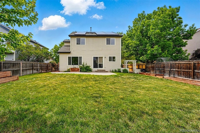 1248 Button Rock Dr, Longmont, CO 80504 - rear view of house featuring a patio and solar panels