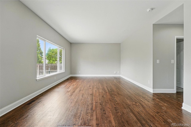 1248 Button Rock Dr, Longmont, CO 80504 - unfurnished room featuring dark wood-style flooring, baseboards, and a smoke detector