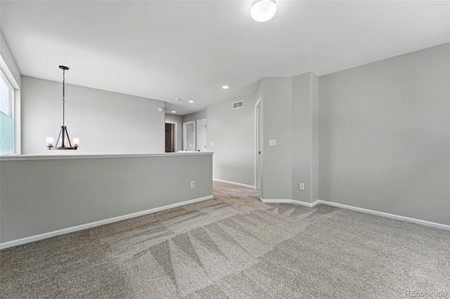 1248 Button Rock Dr, Longmont, CO 80504 - unfurnished room with a chandelier, carpet, baseboards, and recessed lighting