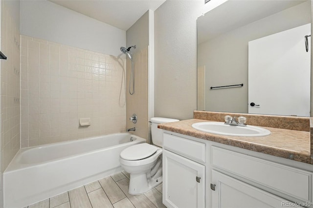 1248 Button Rock Dr, Longmont, CO 80504 - full bathroom featuring vanity, toilet, and bathtub / shower combination