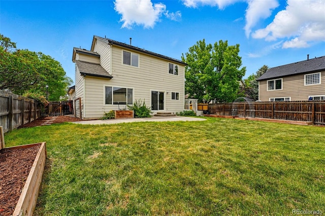1248 Button Rock Dr, Longmont, CO 80504 - back of house with a garden and a patio