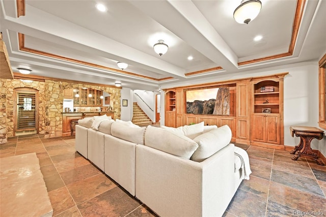 9650 S Cougar Rd, Littleton, CO 80127 - living room featuring stone tile flooring, bar area, stairs, and a raised ceiling