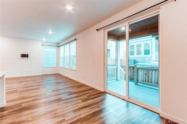 unfurnished room with light hardwood / wood-style floors