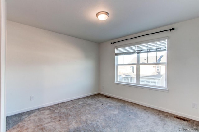 view of carpeted spare room