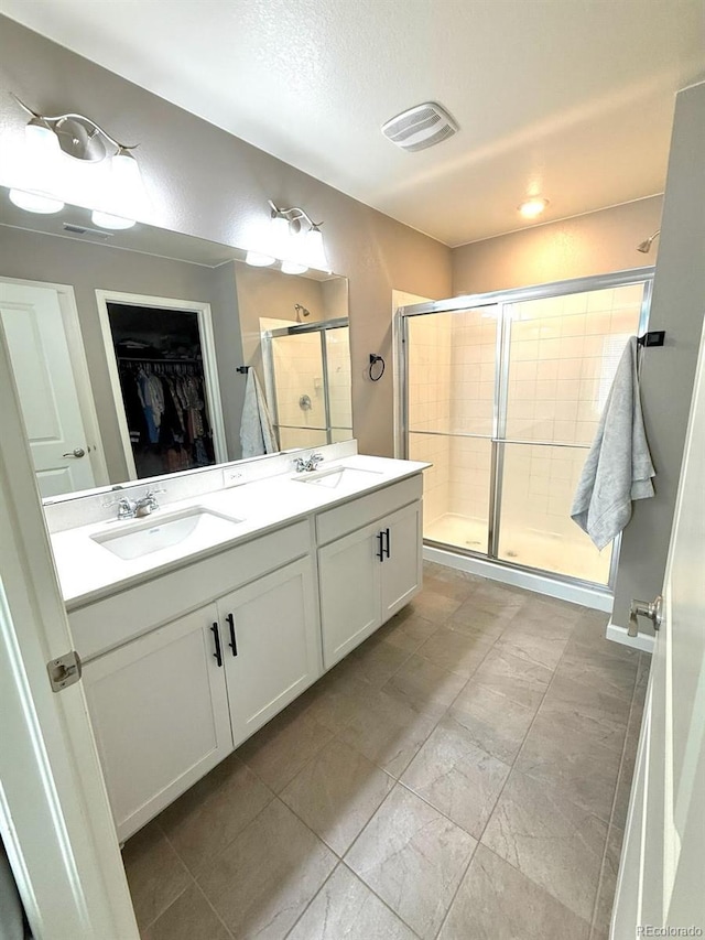 bathroom featuring vanity and walk in shower