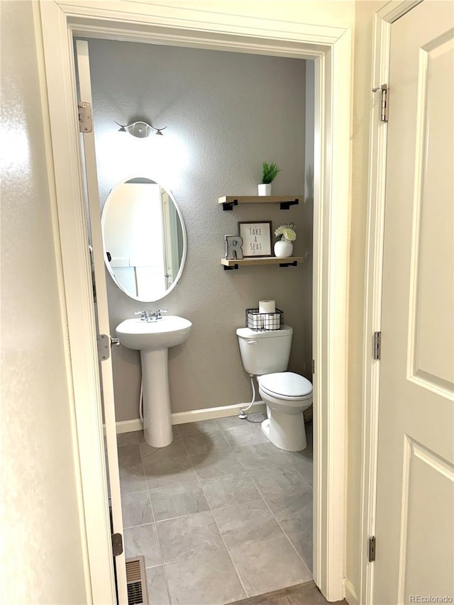 bathroom with sink and toilet