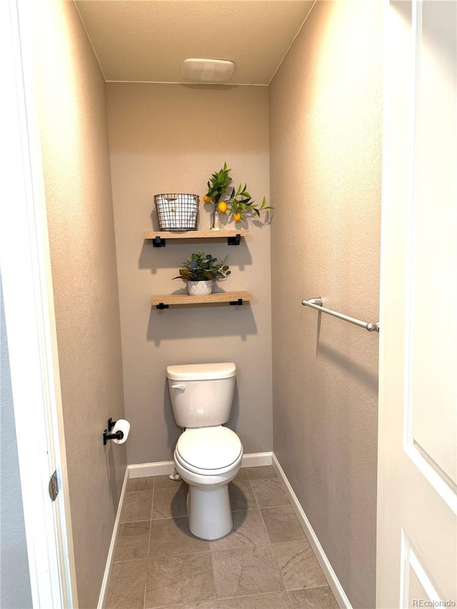 bathroom featuring toilet