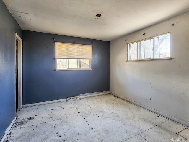 unfurnished room with a wealth of natural light