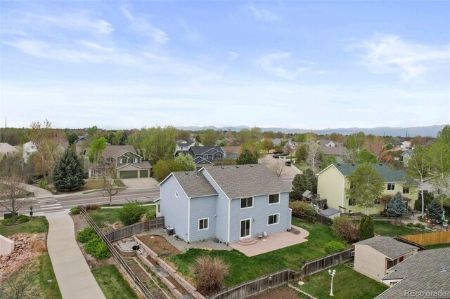 birds eye view of property with a residential view
