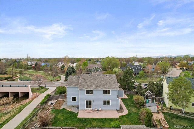 birds eye view of property with a residential view