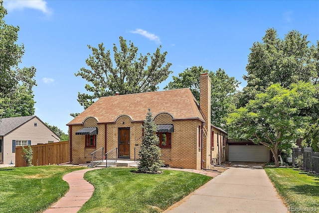1040 N Kearney St, Denver, CO 80220 - tudor house with brick siding and a chimney