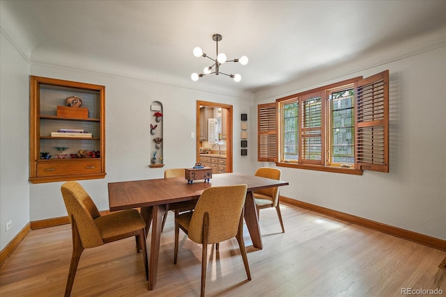 1040 N Kearney St, Denver, CO 80220 - dining room with a chandelier and light wood-type flooring