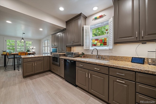 1040 N Kearney St, Denver, CO 80220 - kitchen with dishwasher, light stone counters, a peninsula, gray cabinetry, and stainless steel microwave