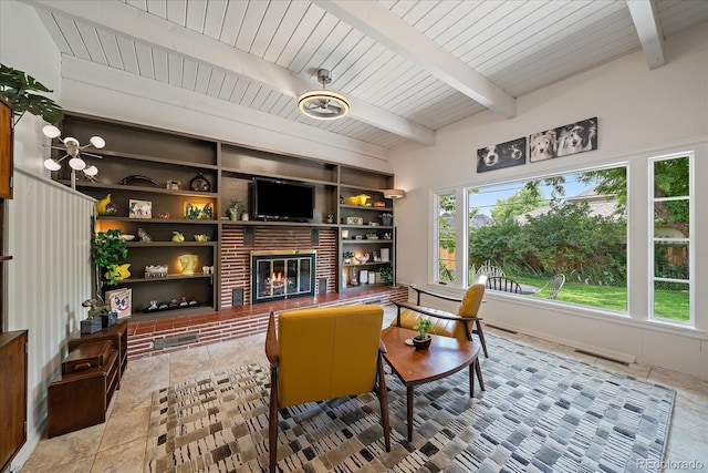 1040 N Kearney St, Denver, CO 80220 - living area featuring a brick fireplace, built in features, and a wooden ceiling with exposed beams