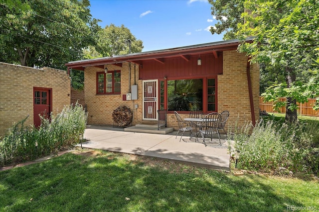 1040 N Kearney St, Denver, CO 80220 - back of house with brick siding and a patio