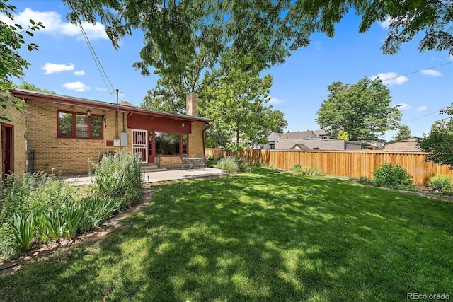 1040 N Kearney St, Denver, CO 80220 - view of yard featuring a patio