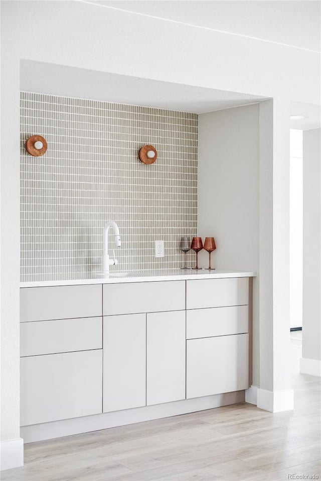 bathroom featuring sink and hardwood / wood-style flooring