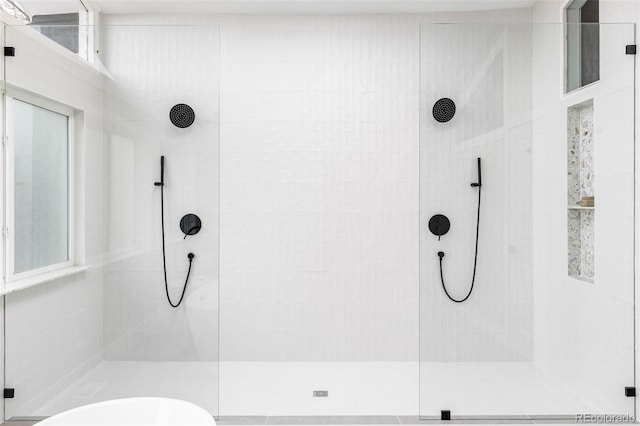 bathroom with tiled shower