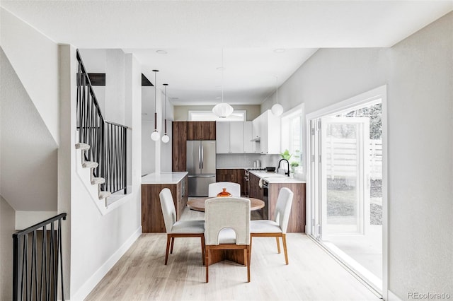 dining space featuring light hardwood / wood-style flooring