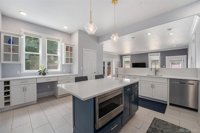 2831 N Humboldt St, Denver, CO 80205 - kitchen featuring appliances with stainless steel finishes, light countertops, recessed lighting, glass insert cabinets, and decorative light fixtures