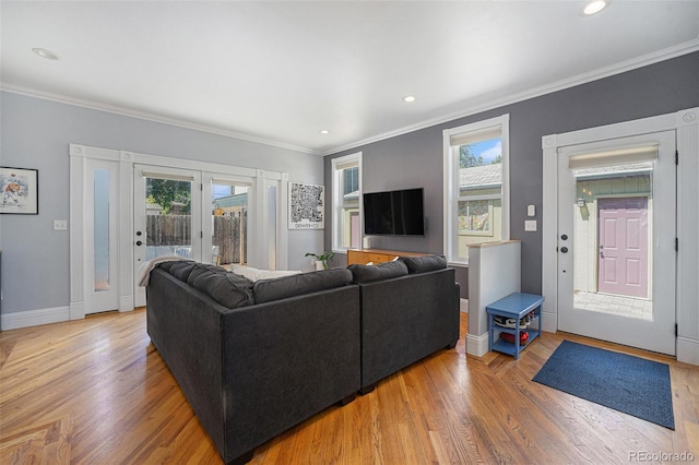 2831 N Humboldt St, Denver, CO 80205 - living room featuring ornamental molding, wood finished floors, french doors, and recessed lighting