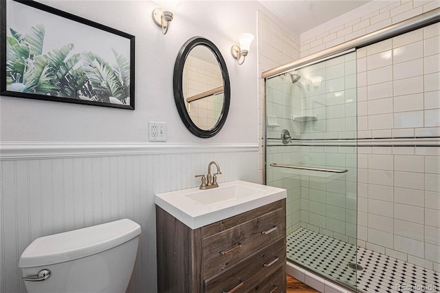 2831 N Humboldt St, Denver, CO 80205 - bathroom with a wainscoted wall, a stall shower, and vanity