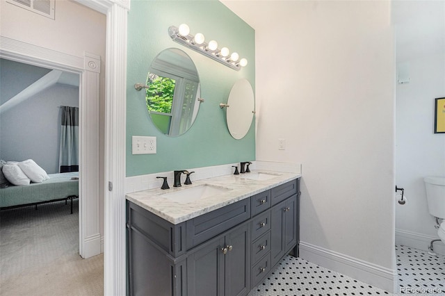 2831 N Humboldt St, Denver, CO 80205 - bathroom featuring double vanity and connected bathroom