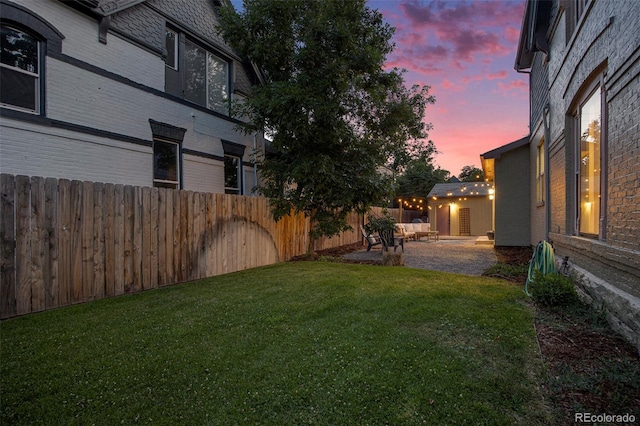 2831 N Humboldt St, Denver, CO 80205 - yard at dusk featuring a fenced backyard and a patio