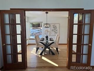 unfurnished dining area featuring wood-type flooring