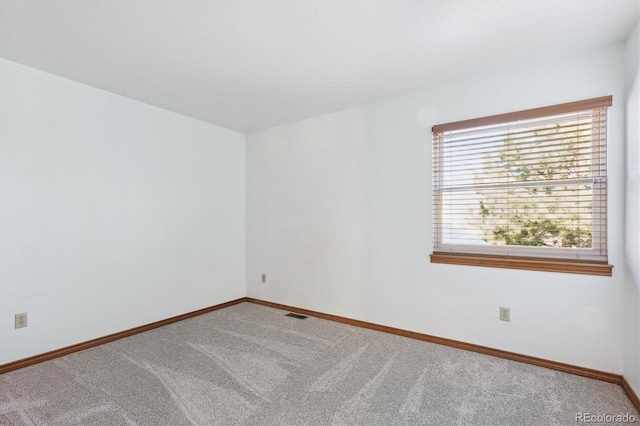 empty room with carpet flooring