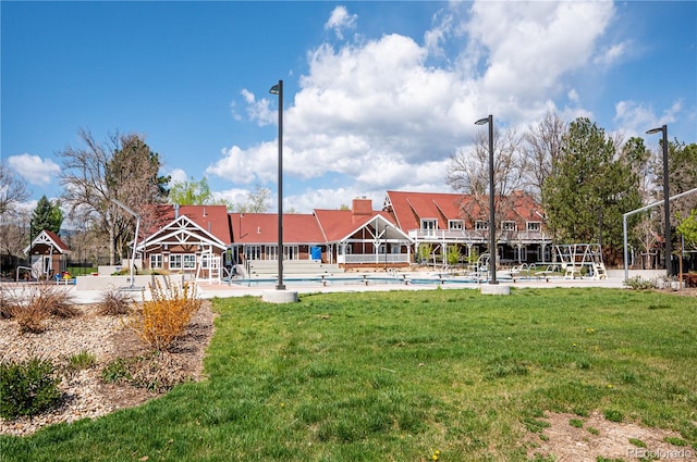 view of community featuring a yard