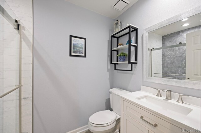 10 Sand Cherry, Littleton, CO 80127 - full bathroom featuring toilet, a stall shower, and vanity
