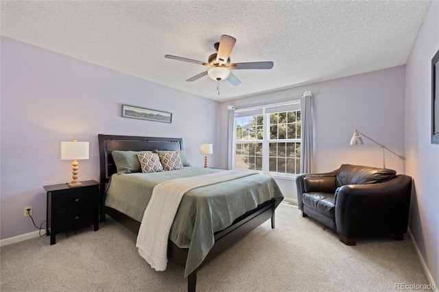 10 Sand Cherry, Littleton, CO 80127 - bedroom with light colored carpet, a textured ceiling, baseboards, and a ceiling fan