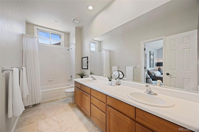 10 Sand Cherry, Littleton, CO 80127 - full bath featuring shower / bath combination with curtain, double vanity, ensuite bath, and toilet
